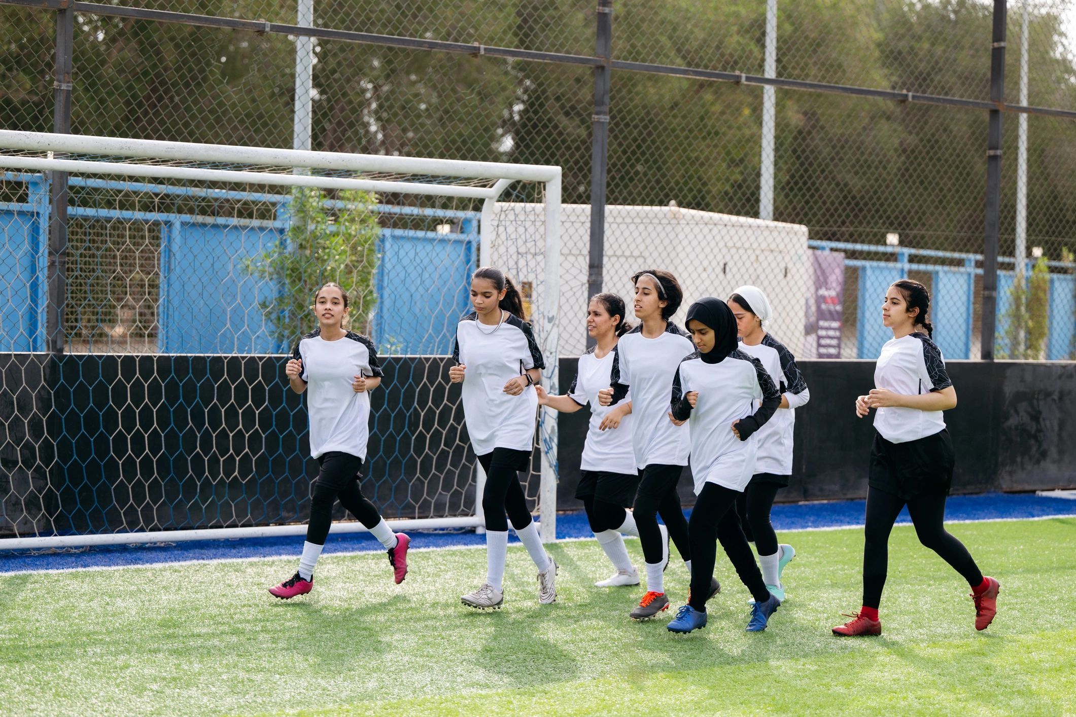 Football team warming up on the field