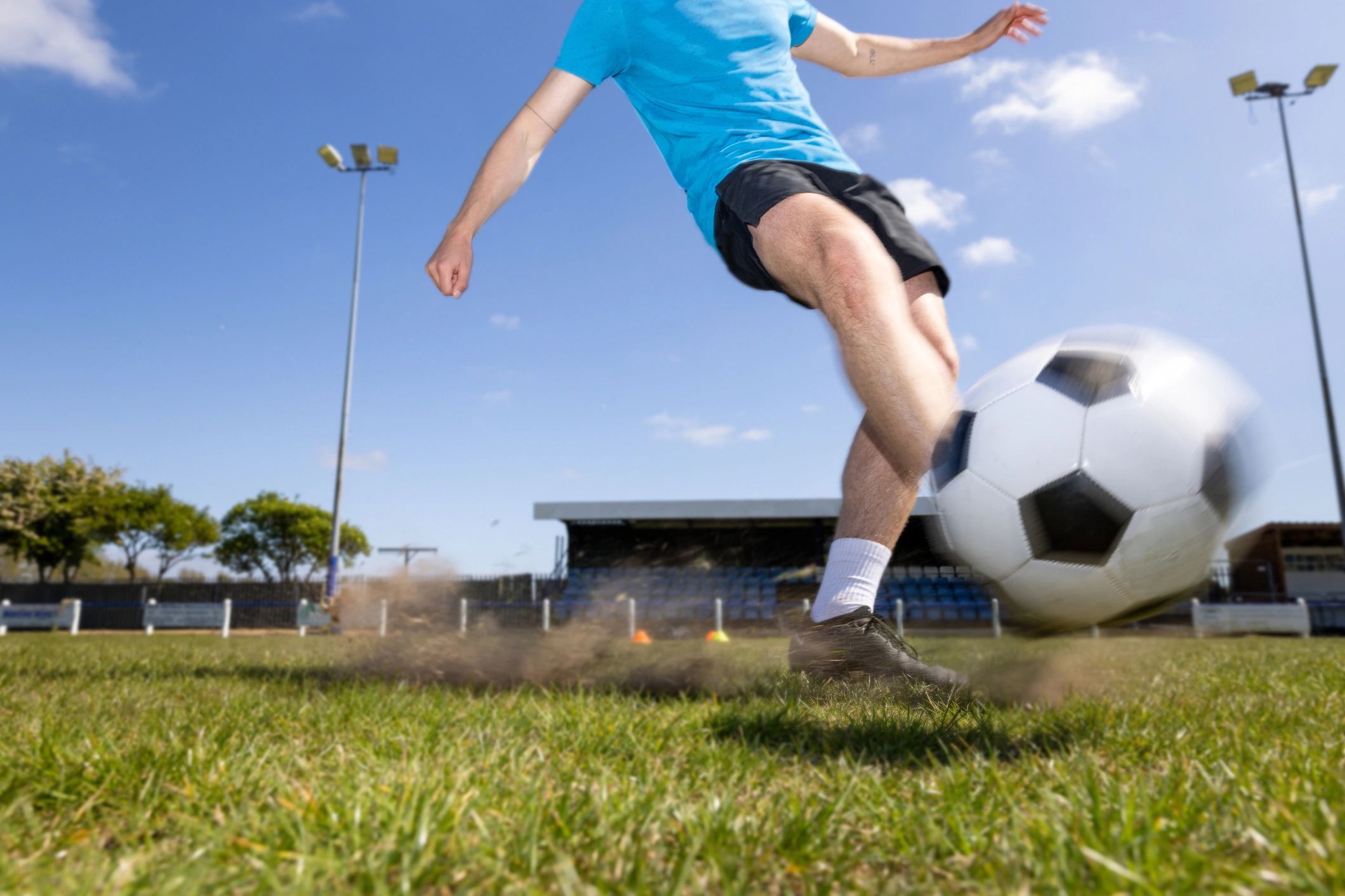 Football kick on an astroturf pitch