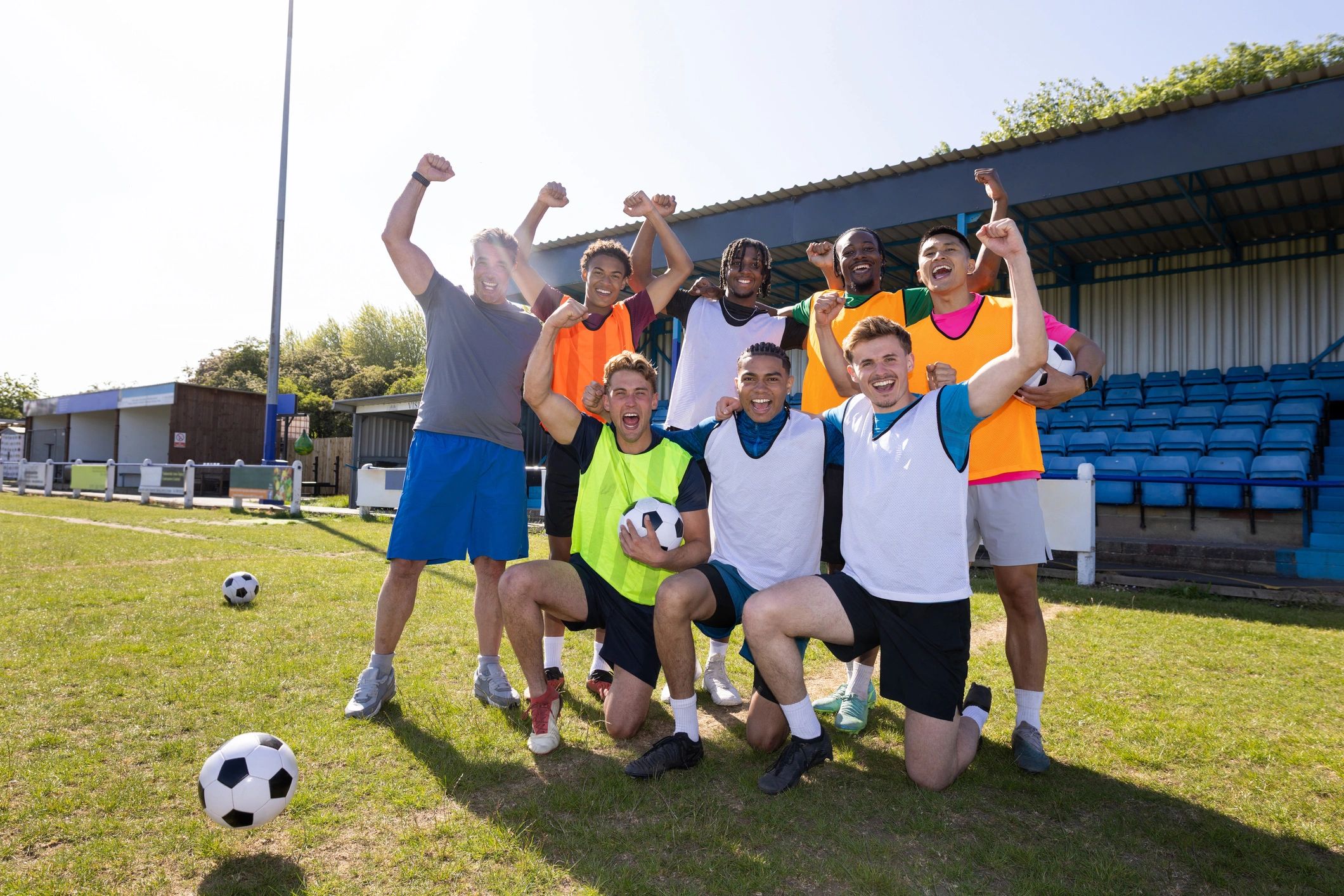 Youth football team celebrating together after a win