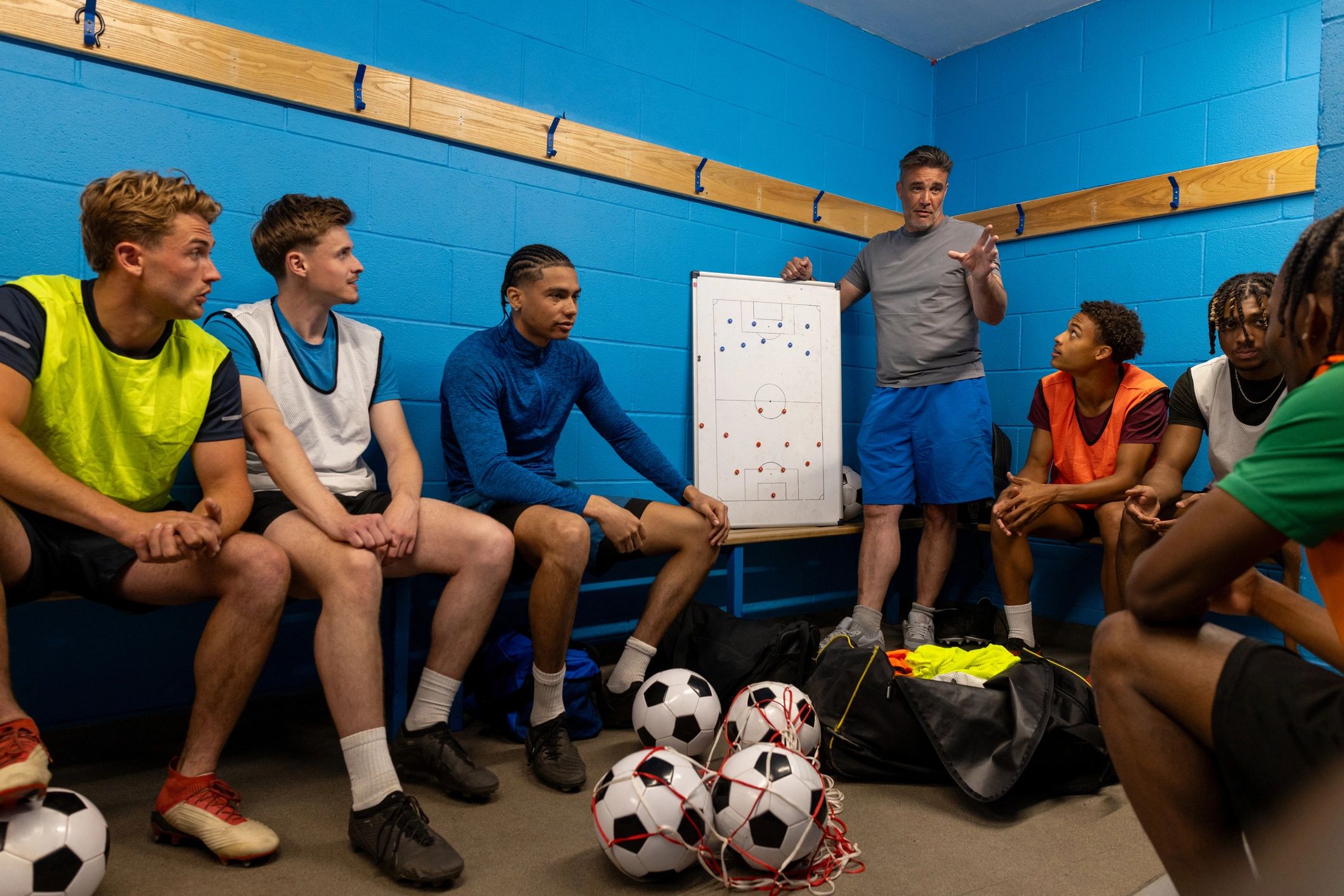 Teenage athletes competing in a football practice match
