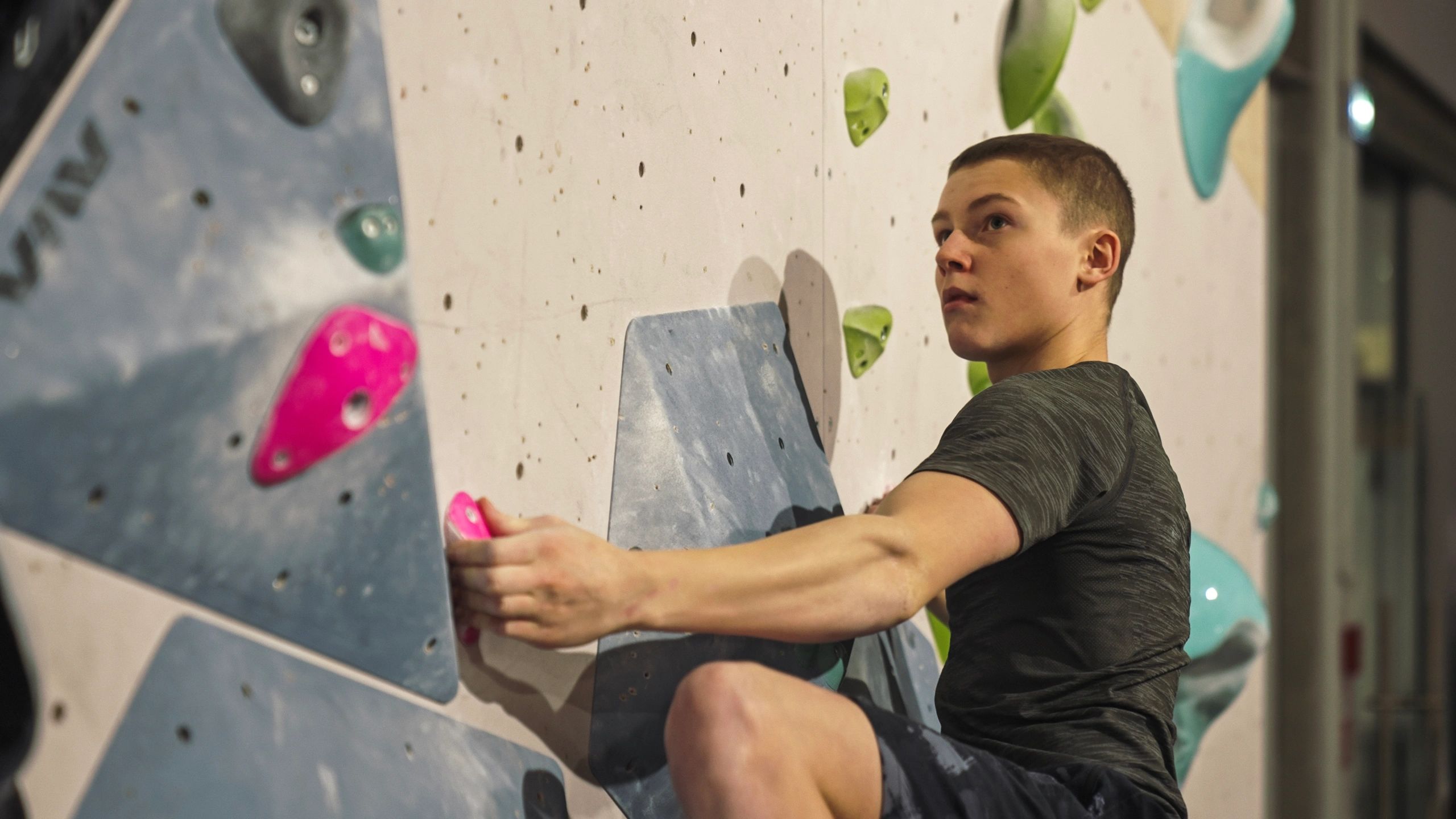 Young athlete climbing to build endurance and coordination