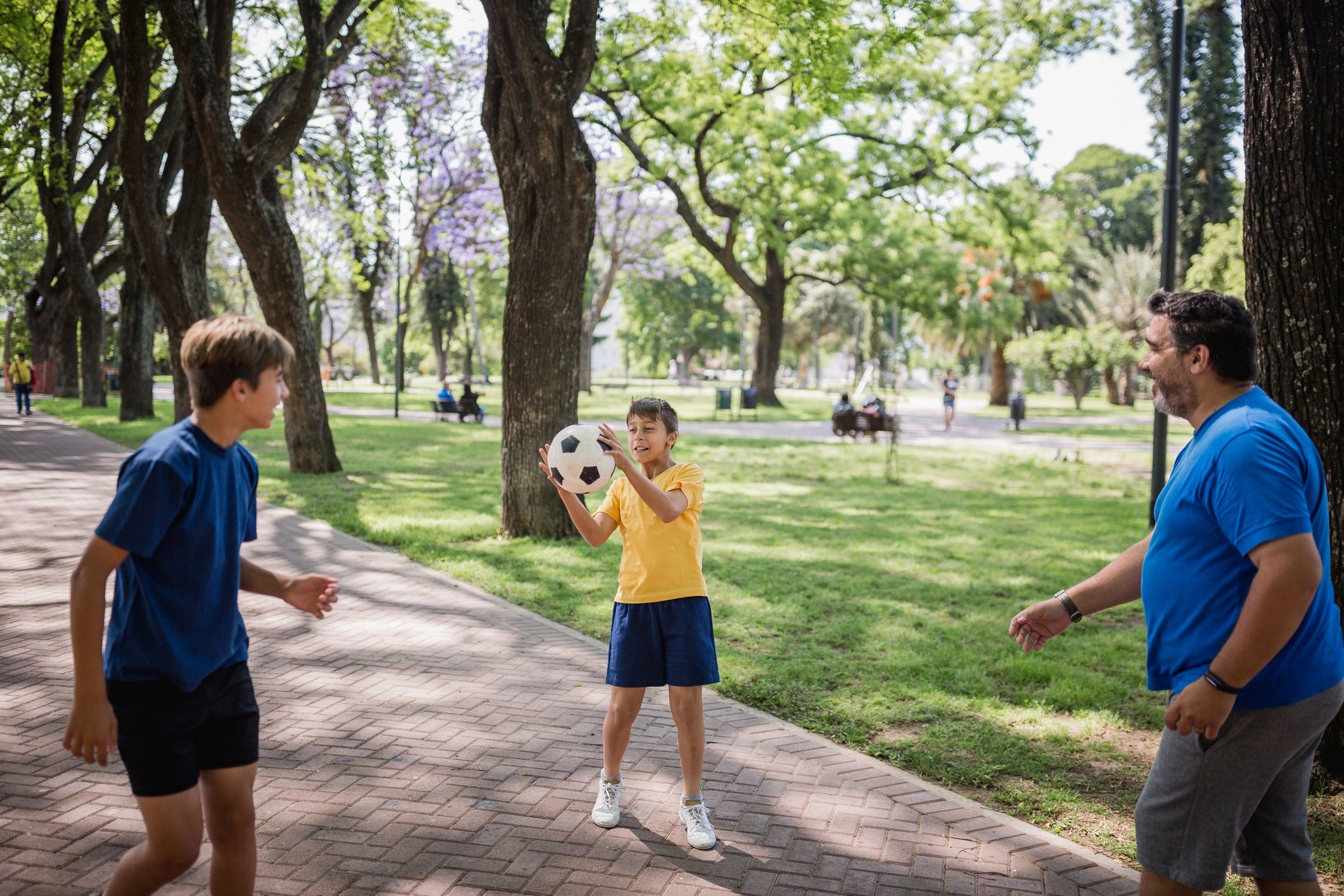 Family enjoying a ball game in the park